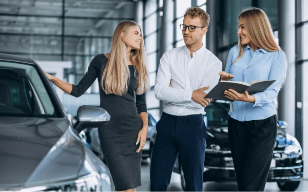 Buyer looking over a used car
